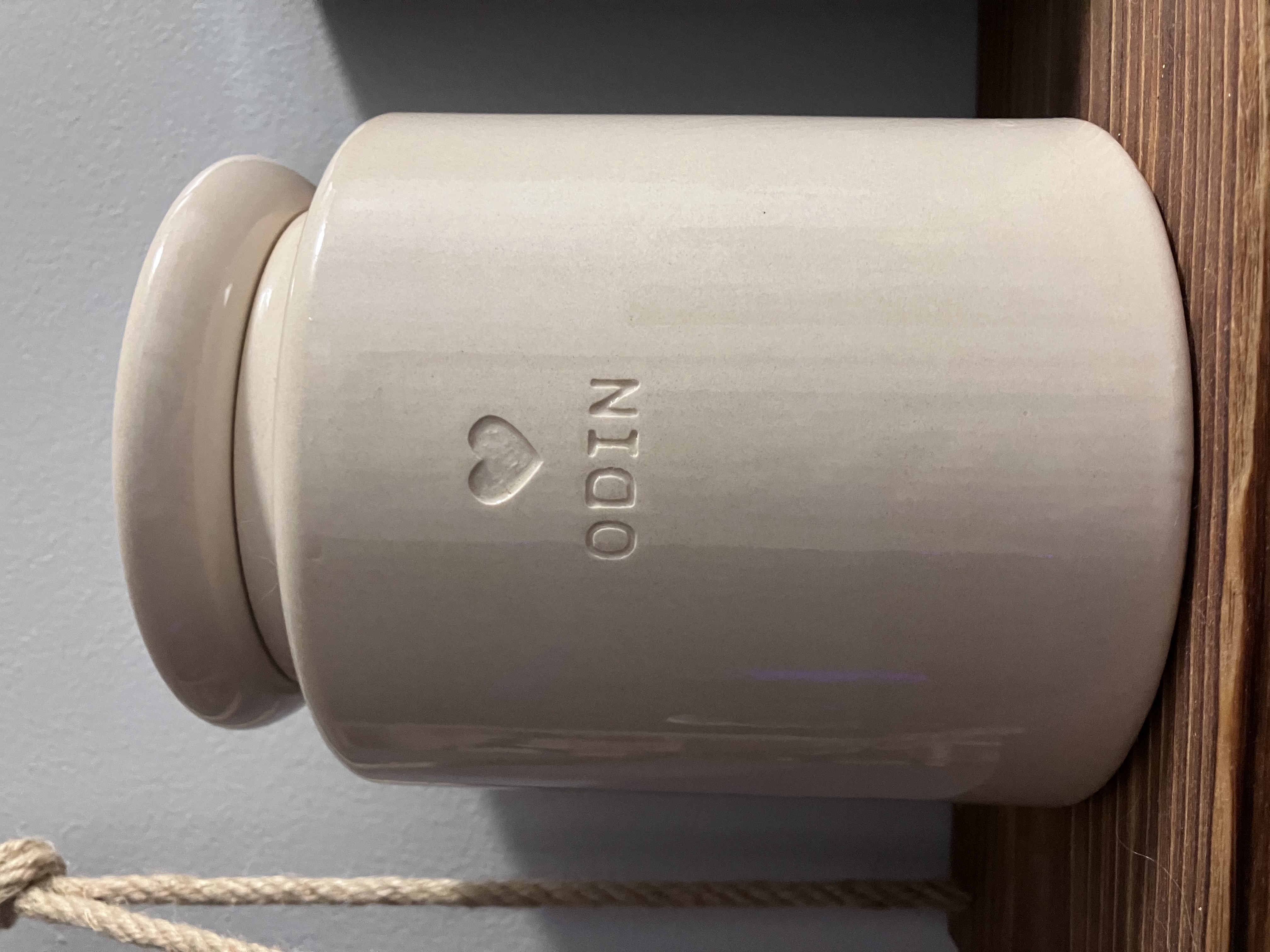 Odin's permanent ceramic urn, personalized with his name and a small heart